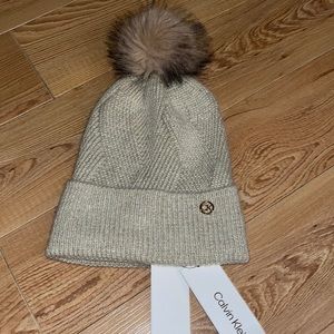 CALVIN KLEIN Cream with Sparkle Highlights Gold Logo Badge Pom Beanie MSRP $48